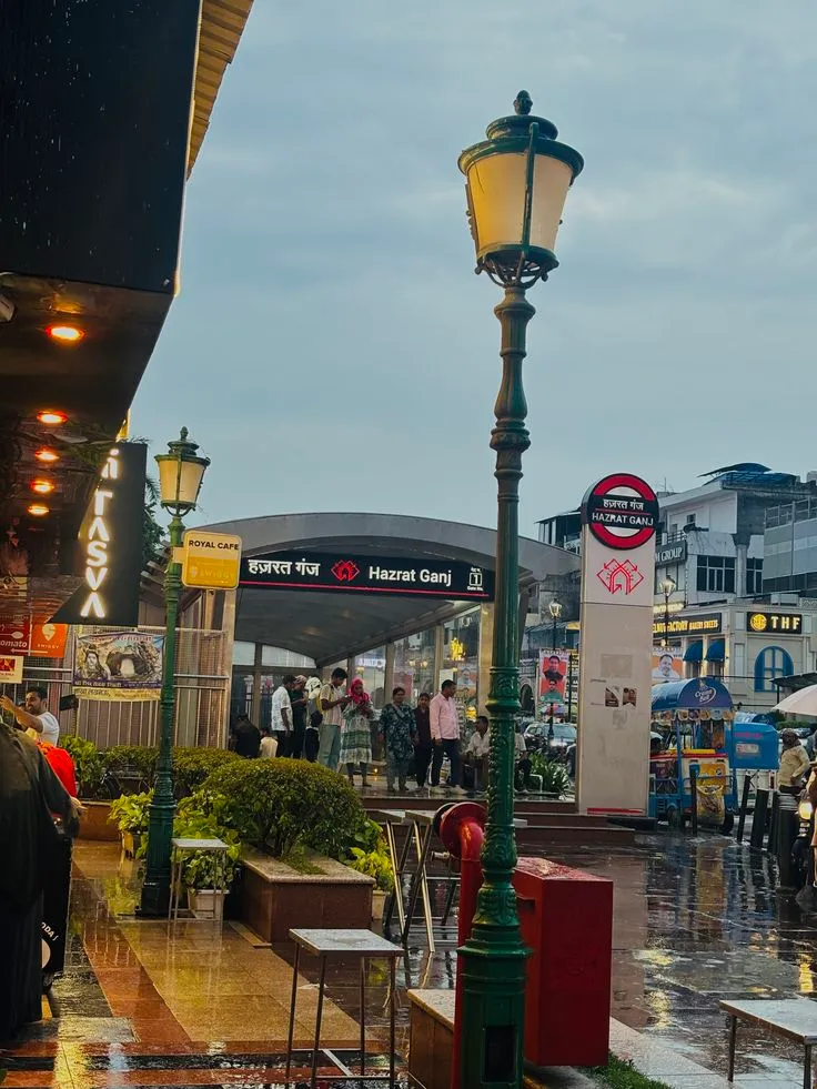 Hazratganj market street in Lucknow with shops, cafes, and evening crowds