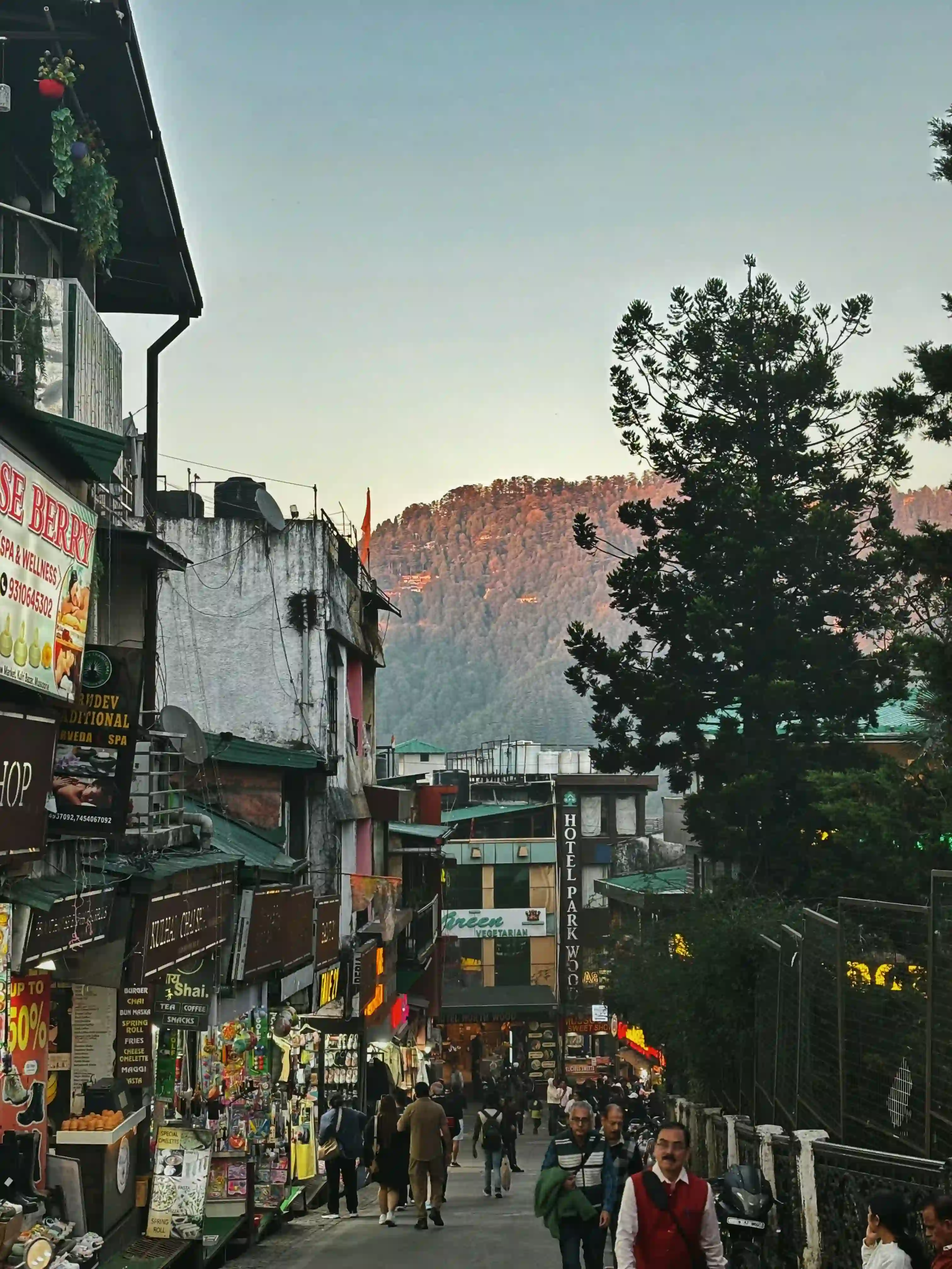 Mussoorie Mall Road with shops, cafes and evening lights
